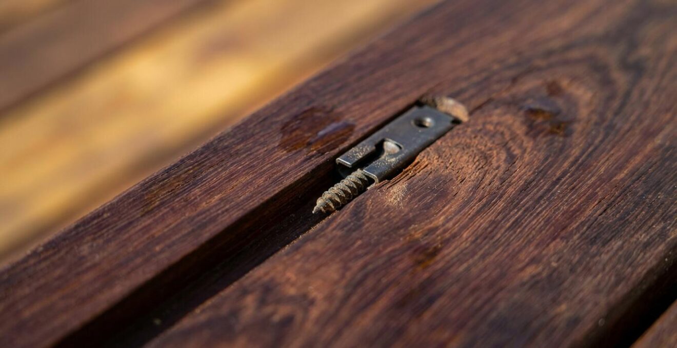 Macro detail of hidden fastener system installation on exotic hardwood decking