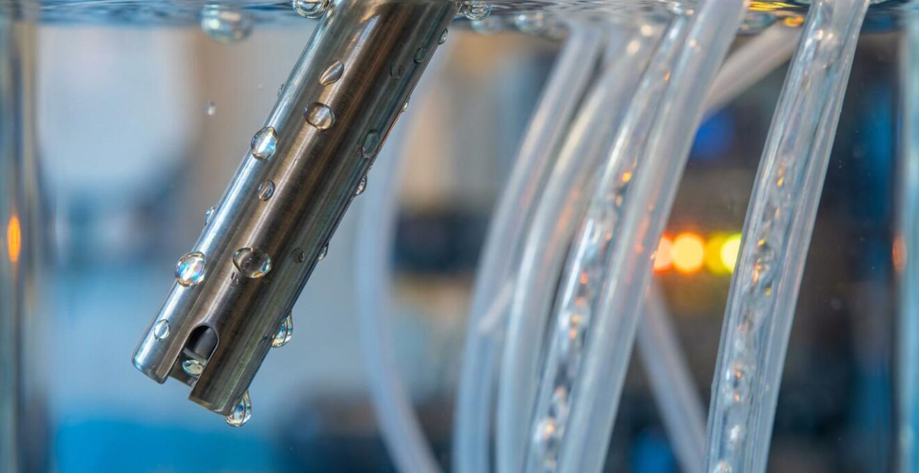 Close-up of ORP sensor and automated chemical dosing equipment