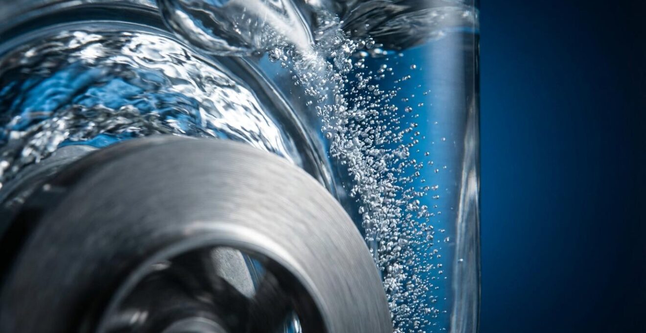 Extreme close-up of cavitation bubbles forming in transparent pump chamber